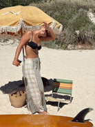 Lady on beach wearing Patchwork Pant in Cottage Plaid | Atmosea