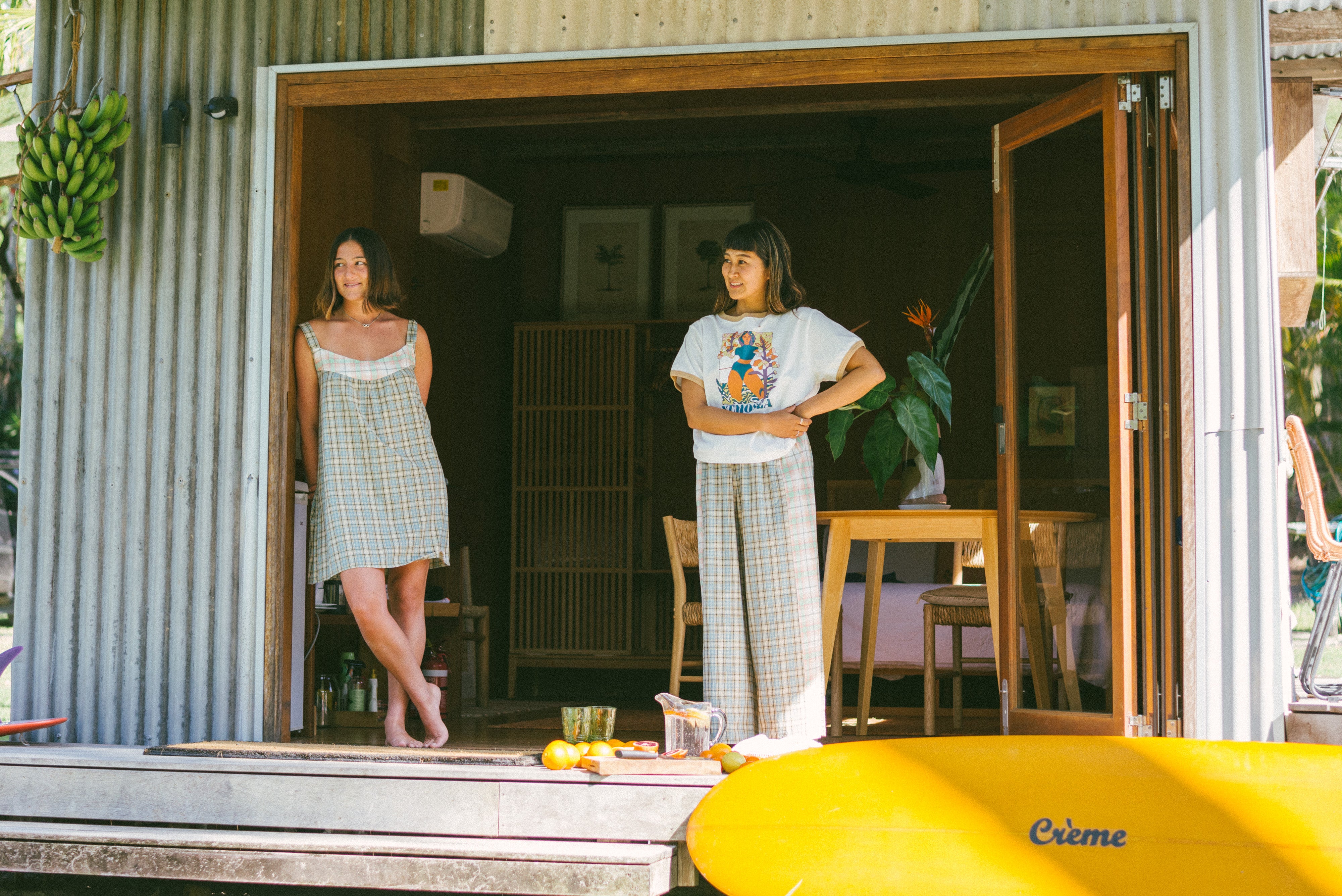 Two ladies on deck, one wearing Patchwork Pant in Cottage Plaid | Atmosea