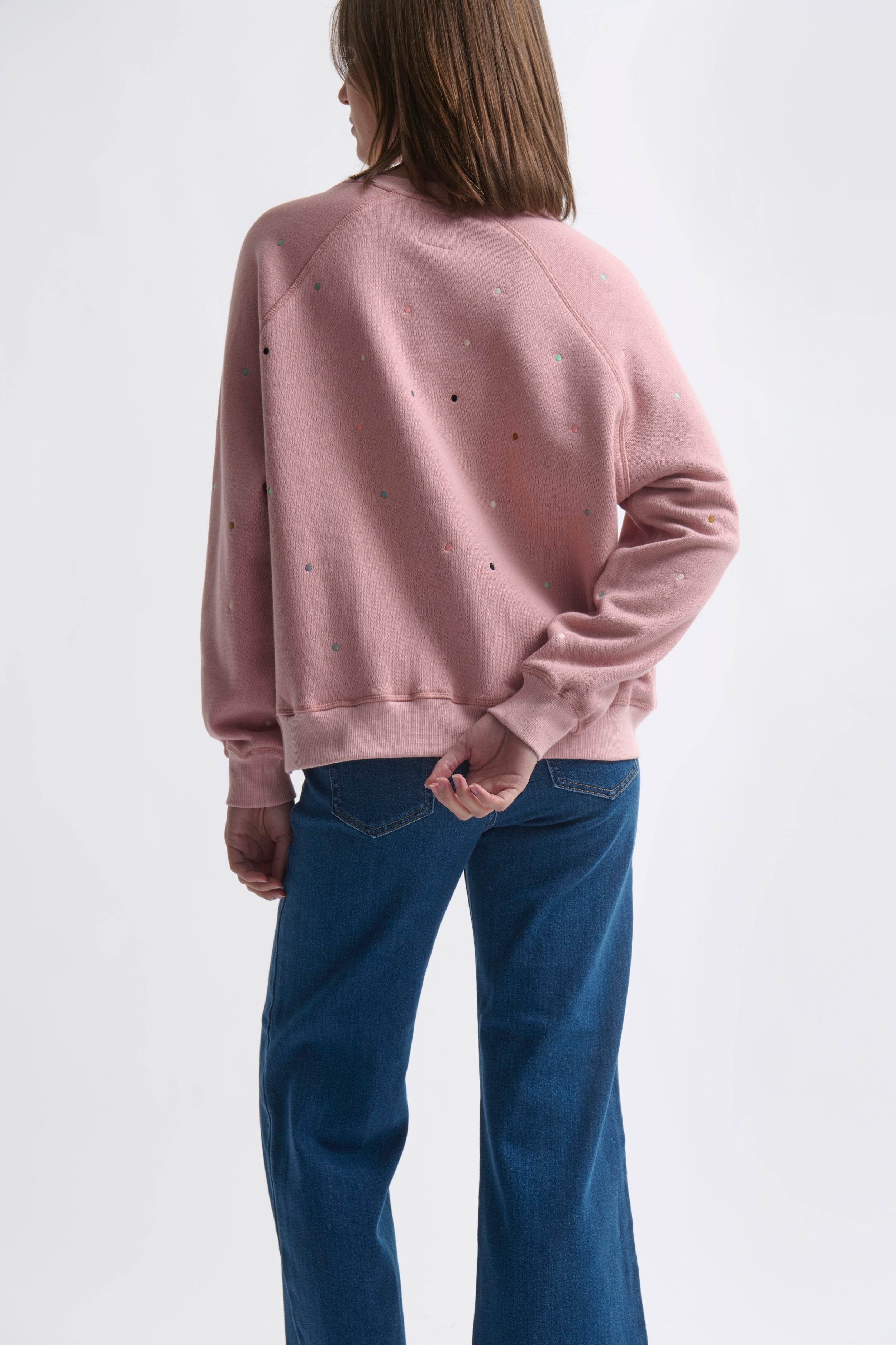 back view of model wearing Patti Sweatshirt by Dot - Musk Pink by Kireina womens cotton top with embroidered polka dots