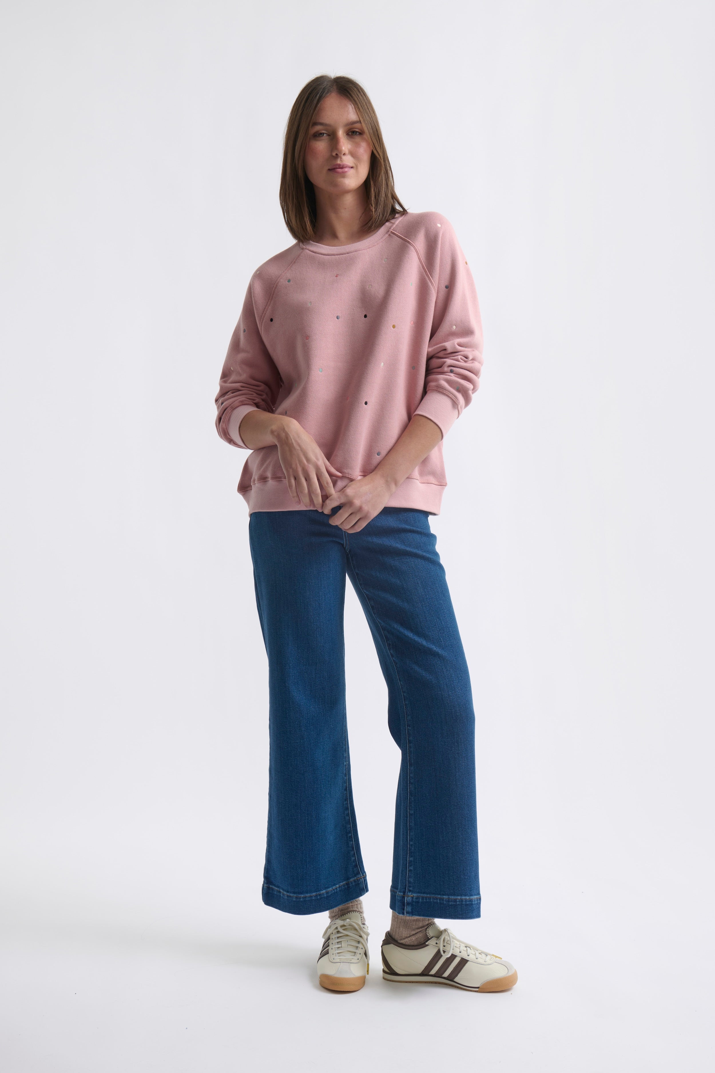 Vintage wash musk pink sweatshirt laid flat showing soft French terry texture and comfortable fit