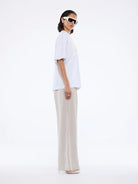 Model side view wearing Pelly Collegiate Tee White Marle by Ena Pelly