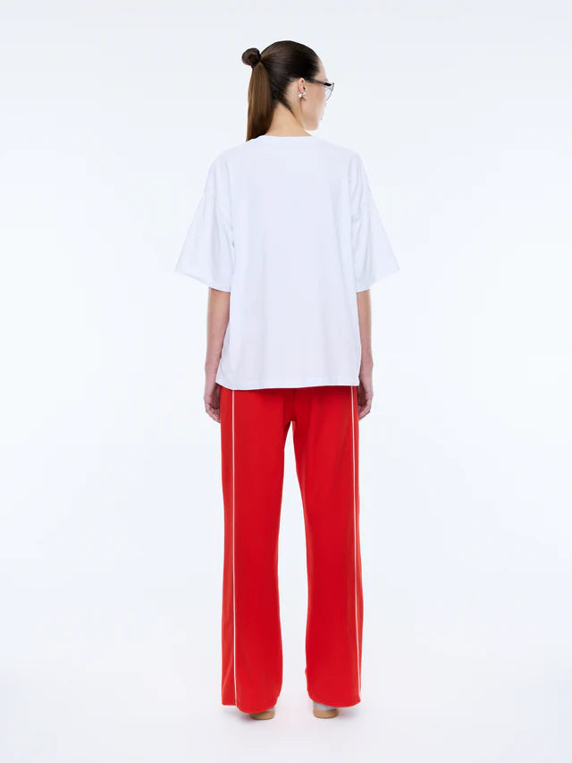 back view of model wearing Pelly Sport Tee White by Ena Pelly