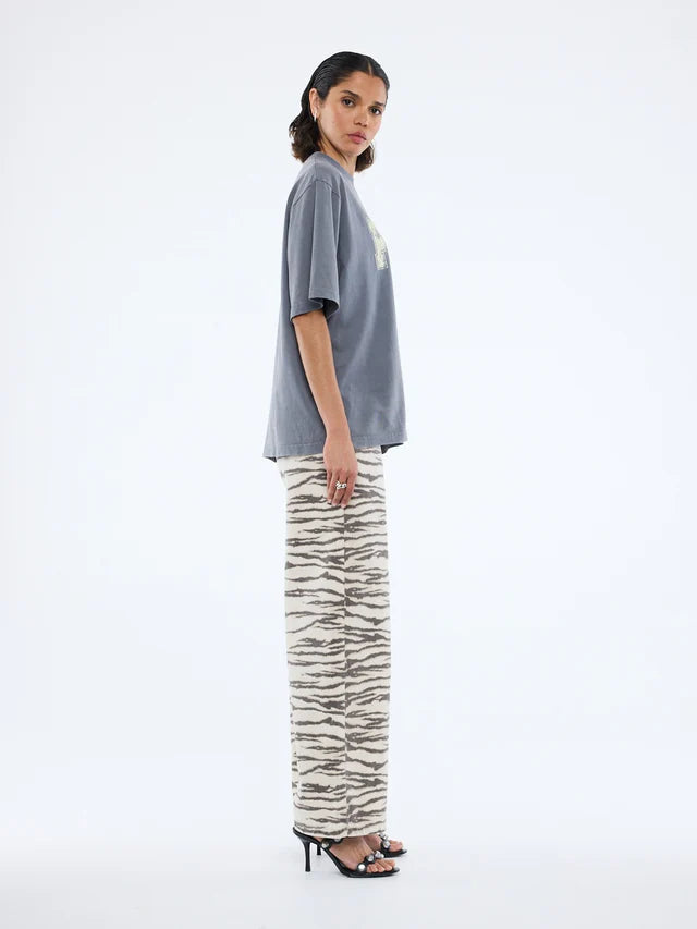side view fo model wearing Pelly World Tour Tee - Washed Grey by Ena Pelly