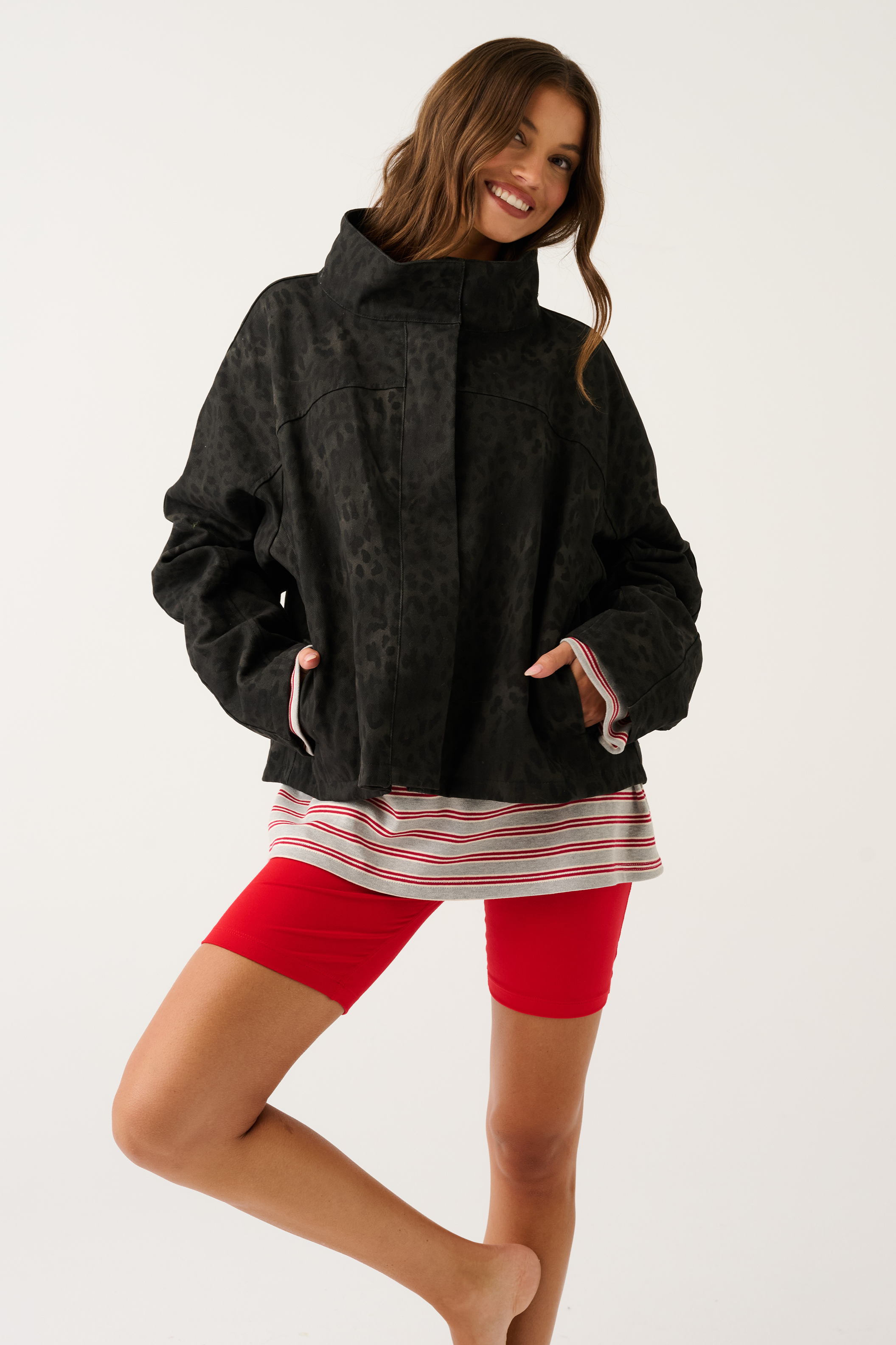 Black washed leopard print oversized jacket with funnel neck, angled front view showing relaxed fit