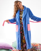 Front view of Kip & Co Pie In The Sky blue waffle textured robe with pink pockets and tie belt