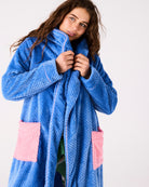 Close-up front view of blue waffle textured Pie In The Sky robe showing collar and pink pocket detail