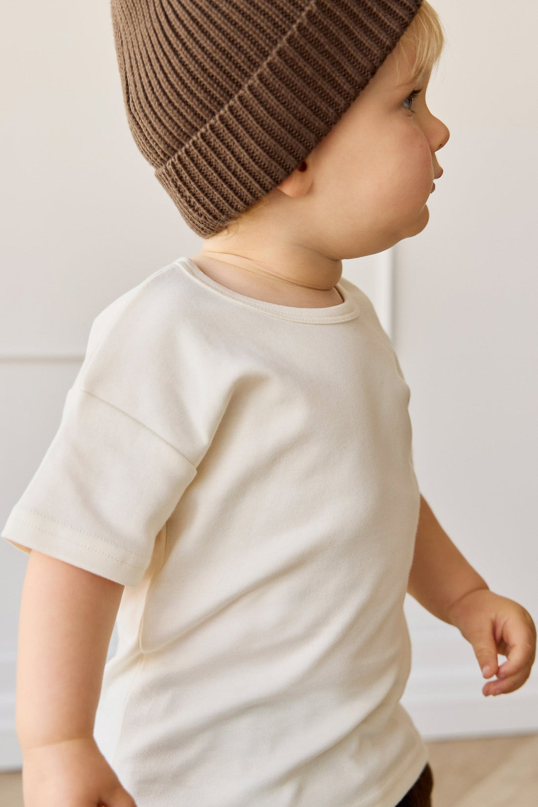 Side view of young boy in the white Pima Cotton Eddie Tee - Cloud | Jamie Kay