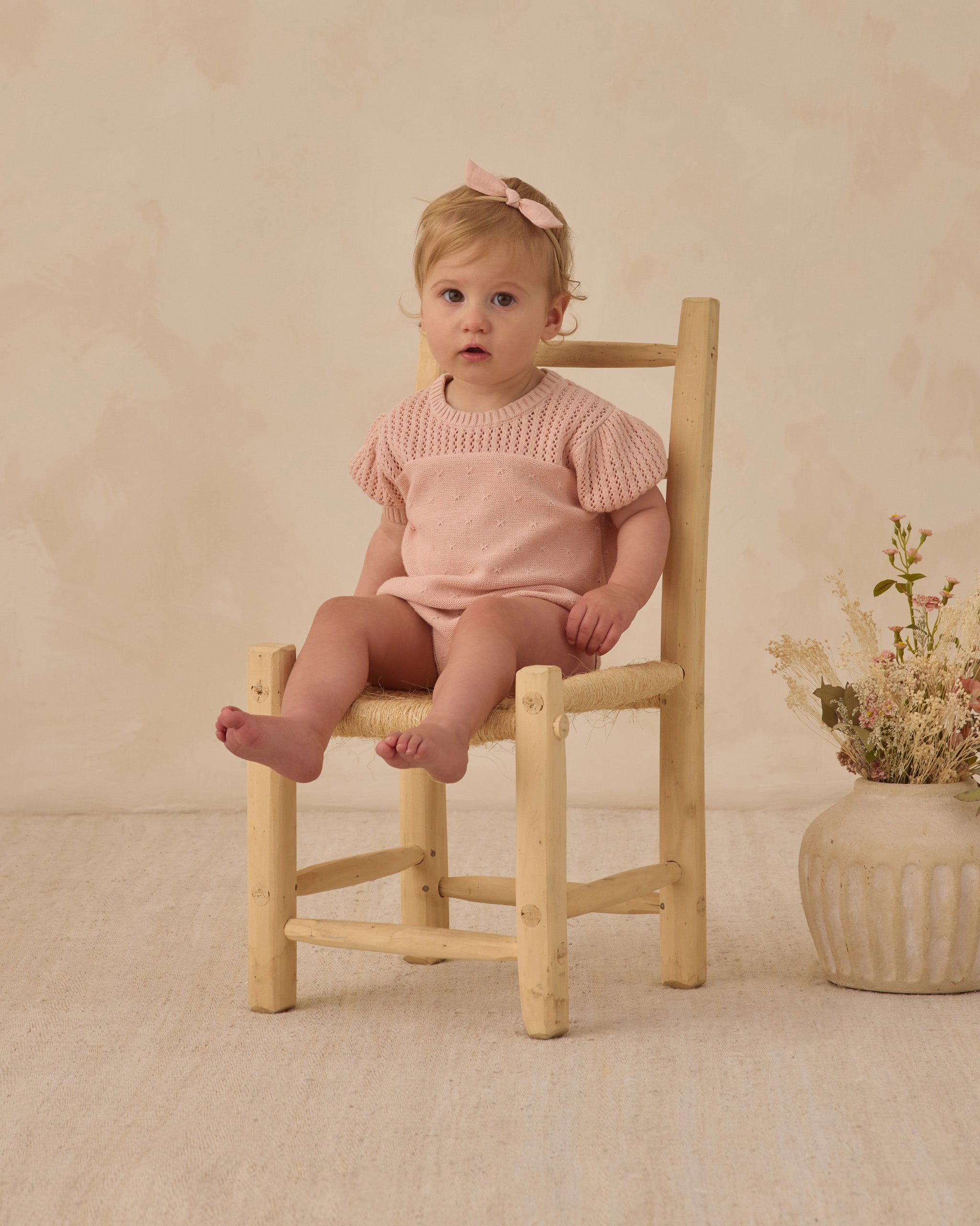 Front view of toddler in the pink Pointelle Knit Romper Melon | Quincy Mae
