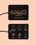 Close-up of Kip & Co organic brand tags showing sustainability and quality certifications