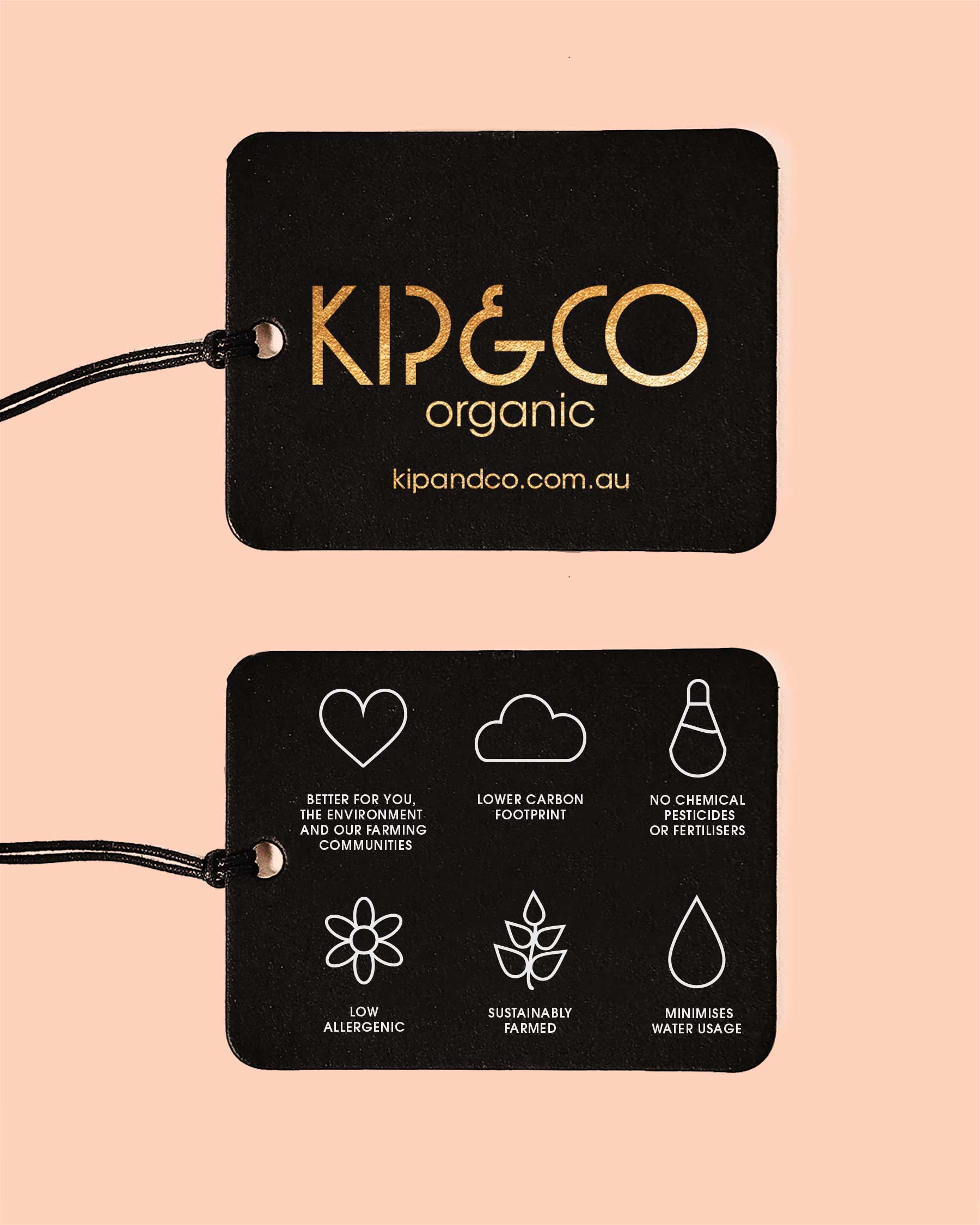 Close-up of Kip & Co organic brand tags showing sustainability and quality certifications
