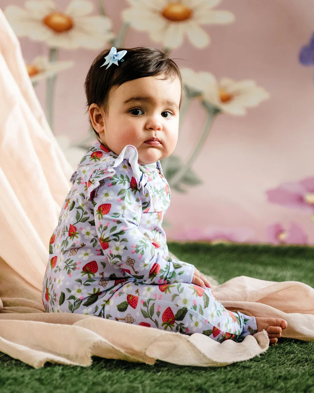 Young child wearing the Precious Frill Coverall - Violet | Fleur Harris