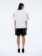 Racing Pelly Swoop tee fabric detail showing soft cotton material and vintage white wash finish quality