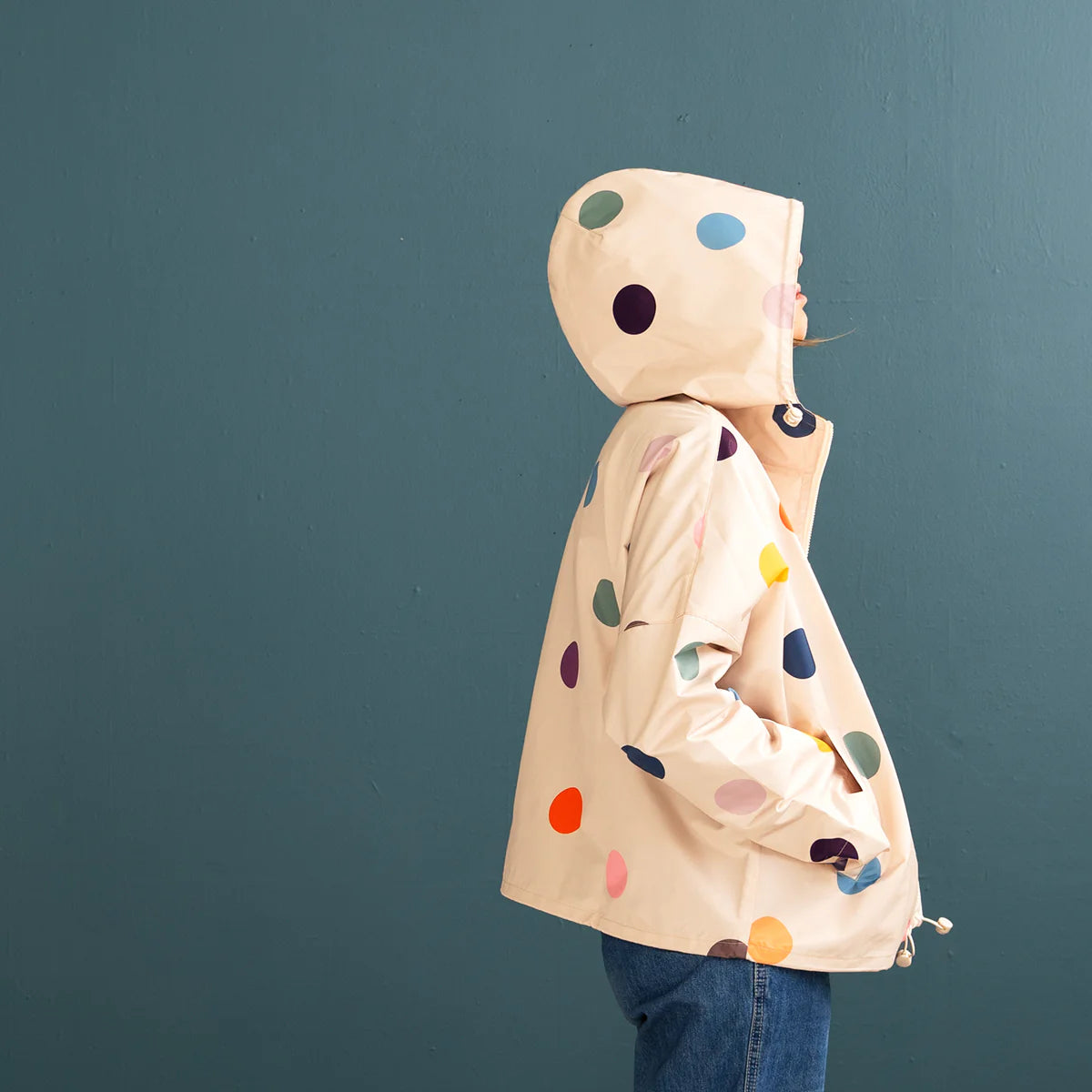 White raincoat with coloured dots with hood and pockets