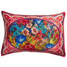 Red silk pillowcase with colourful floral bouquet oval medallion and decorative border, product shot on white
