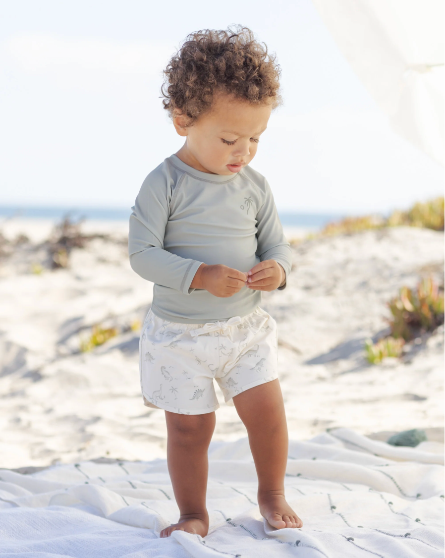 Young boy walking in the Rashguard Sage | Quincy Mae