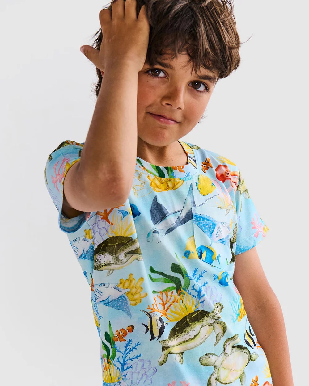 Reef life kids pyjama set by Kip & Co with sea creatures on blue fabric