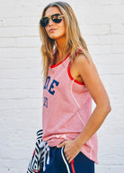 Model wearing red and white tank top with navy writing by Hammill & Co