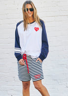 model wearing Hammill & Co long sleeved tshirt with a red heart