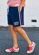 Model wearing Retro Shorts with Side Stripes - Navy by Hammill & Co