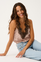 Rita Cami in ocelot print with black lace trim detail and v-neckline styled with light blue jeans