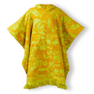 Flat lay of Rosalia Kids Poncho in Dune showing yellow terry fabric with hood and fringe details