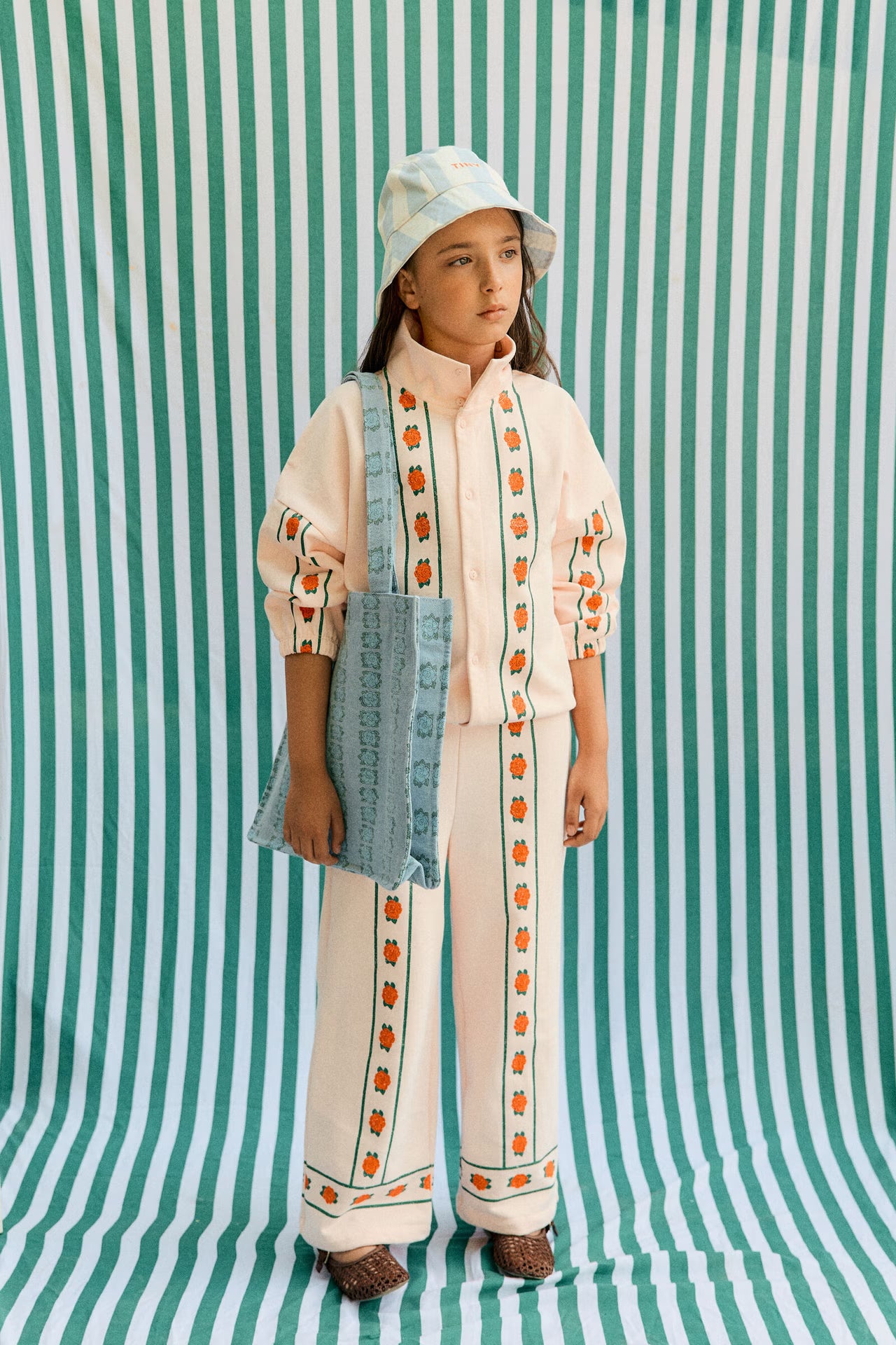 Girl wearing Roses Straight Sweatpant – Pastel Pink by Tiny Cottons