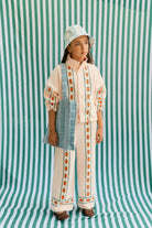 Girl wearing Roses Straight Sweatpant – Pastel Pink by Tiny Cottons