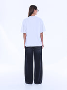 Back view of Sophia Relaxed Tee showing plain white cotton design and relaxed silhouette from behind