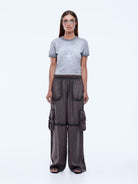 front view of model wearing  Ena Pelly Stardust Utility Pants showing cargo pocket placement and fit