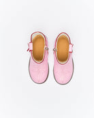 Top-down view of pink Sadie boots showing tan leather insoles and adjustable ankle straps with buckles