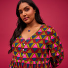 Sage and Clare pirro dress in green, pink and dark teal