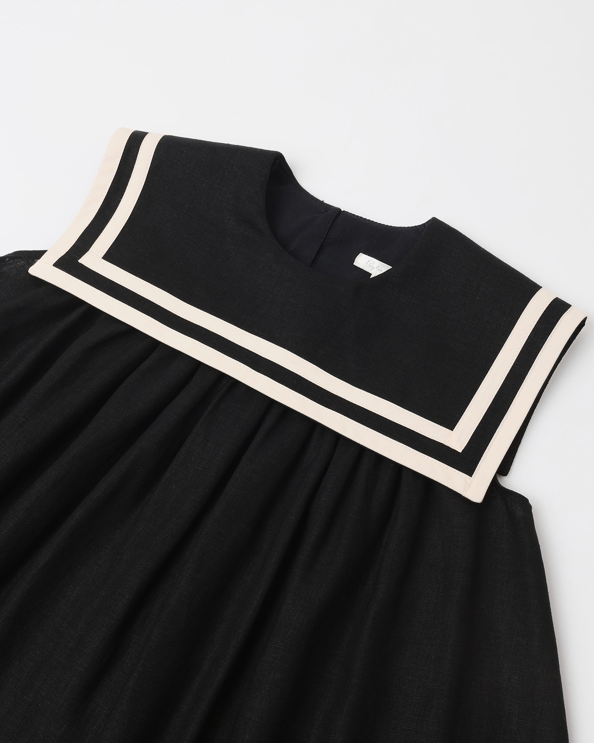 Close up of neckline and fabric on the Sailor Dress Black | Rylee + Cru
