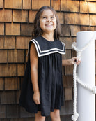 Girl wearing the Sailor Dress Black and white | Rylee + Cru
