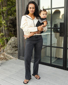 Side view of baby in the Sailor Romper Black | Rylee + Cru