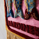 Fabric Detail of Sandria Woven Wall Hanging by Sage & Clare - pink woven wall hanging depicting sardines 