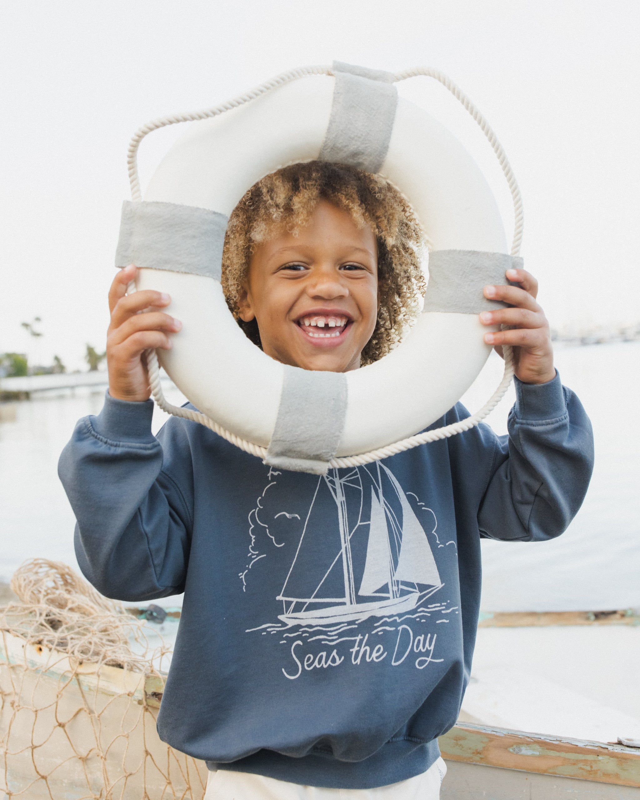 Boy wearing the Seas The Day Sweatshirt  | Rylee + Cru