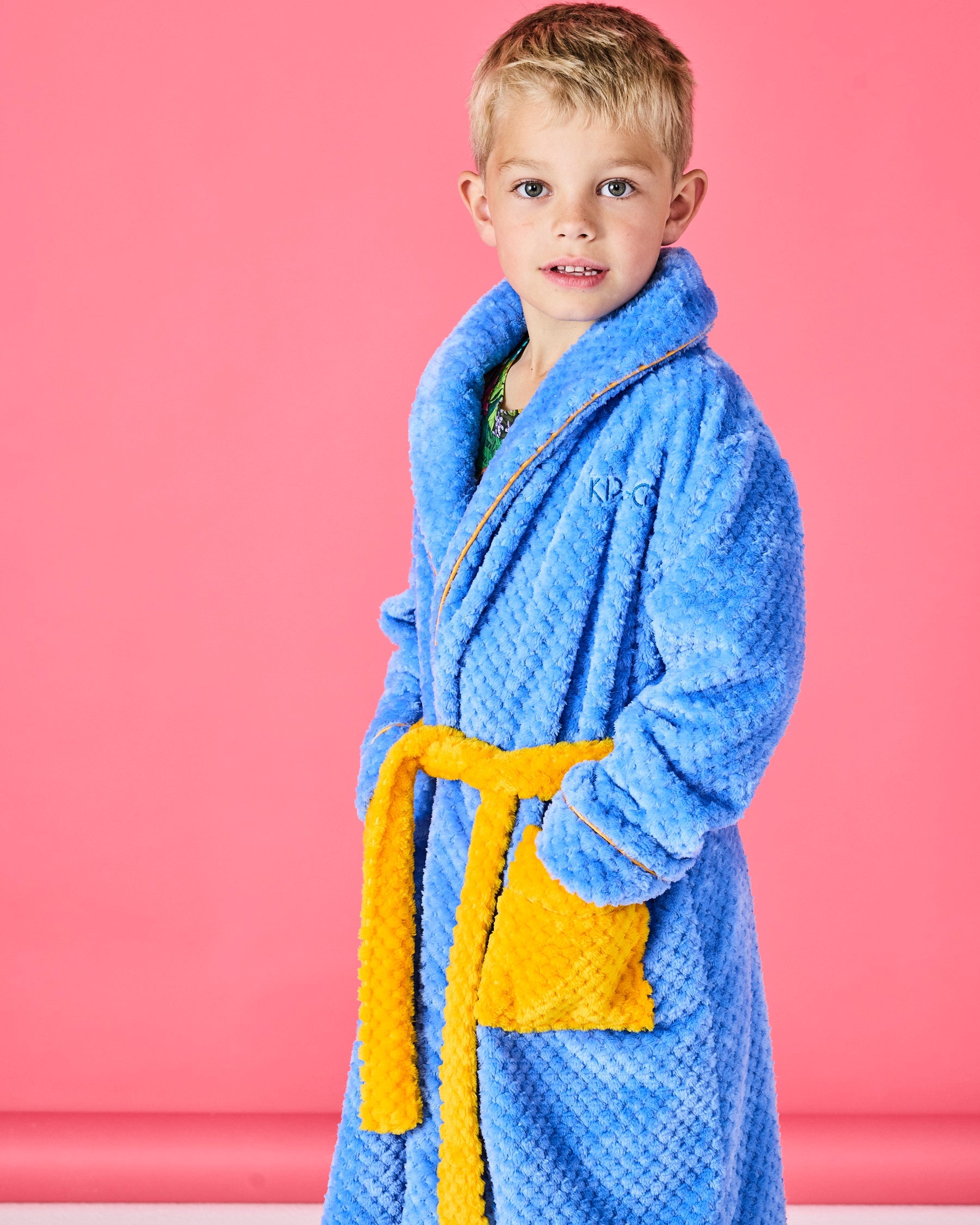 Kip & Co black product tags with gold branding and sustainability icons for kids cosy robes