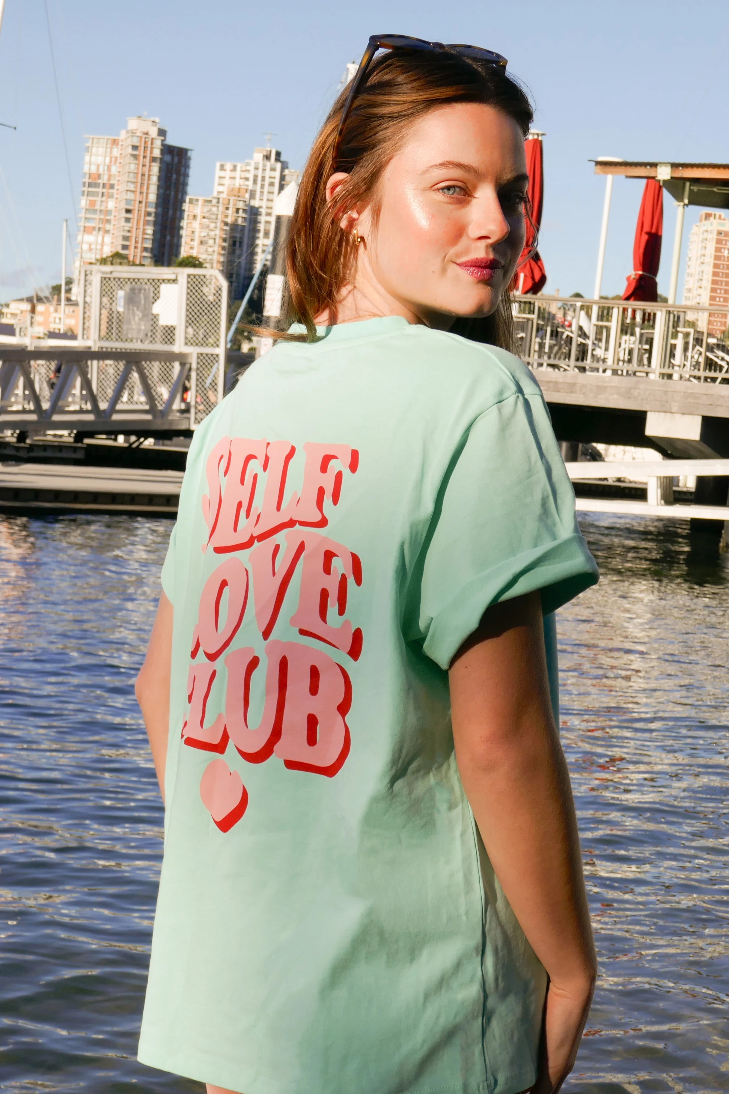model wearing mint / pink Self Love Club Tshirt by Cartel and Willow