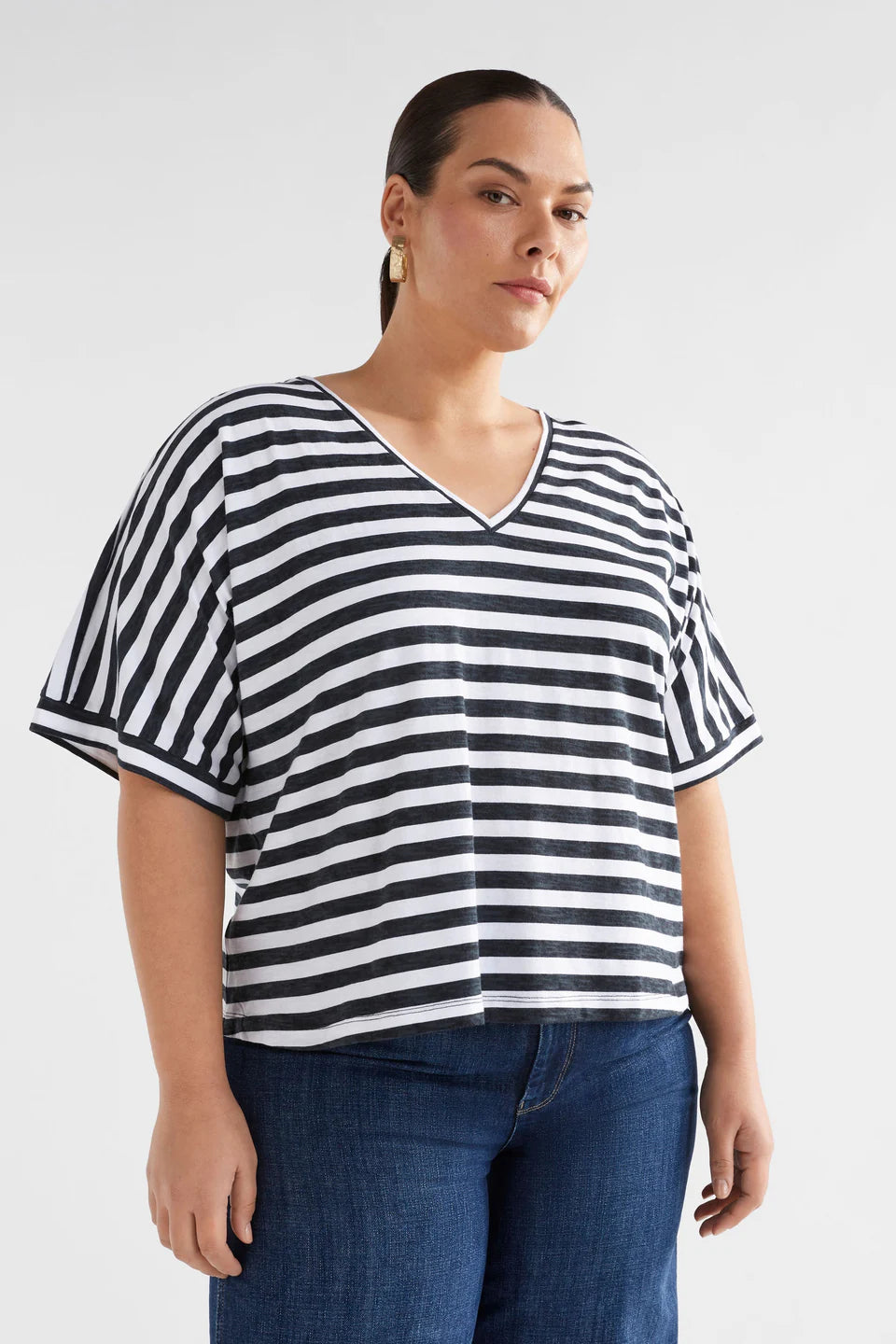 model wearing Seter Tee Black and White Stripped by ELK