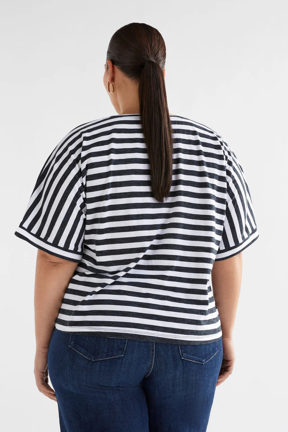 back view of model wearing Seter Tee Black and White Stripped by ELK