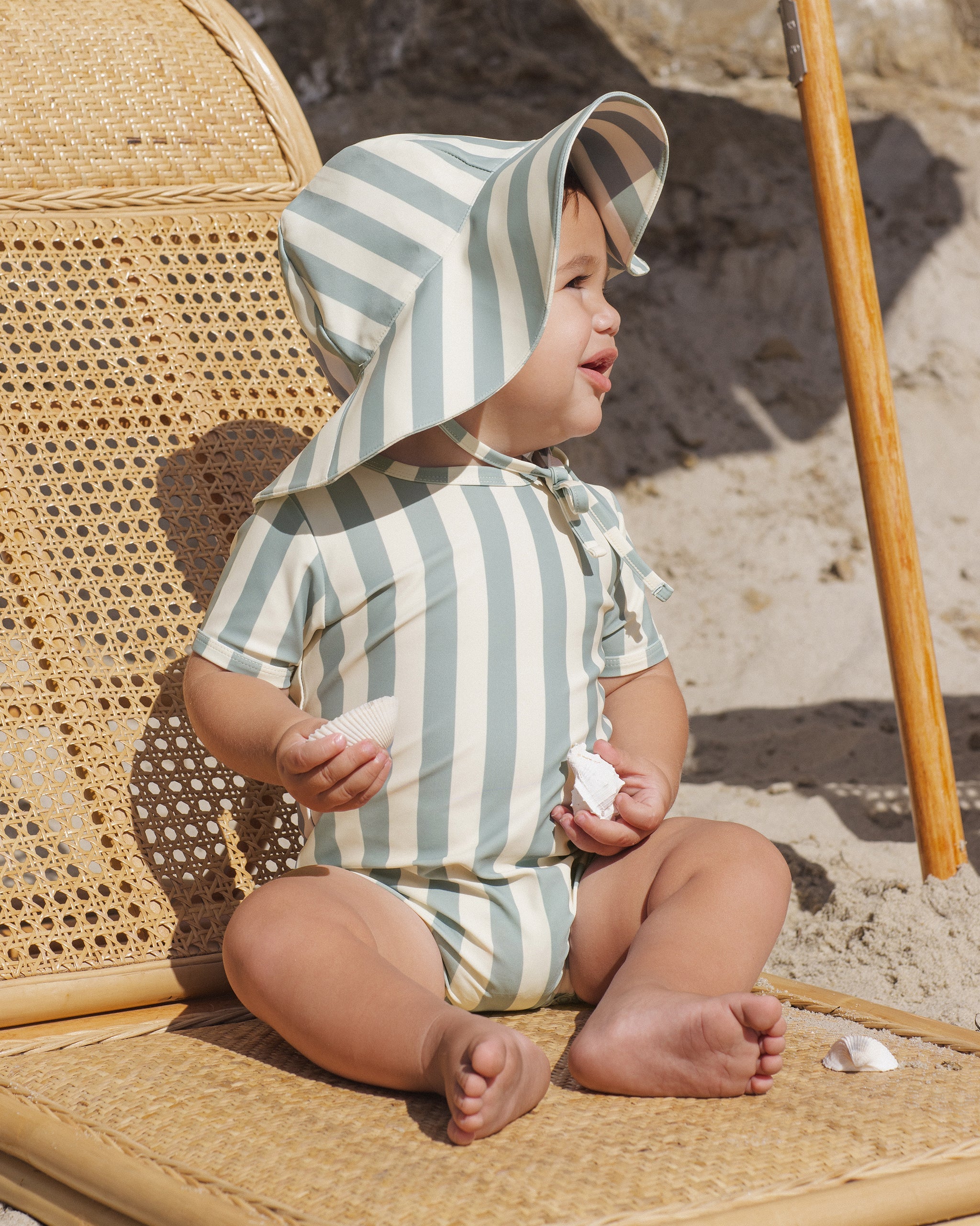 Toddler wearing the Shorty One-Piece Green Stripe | Rylee + Cru