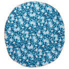 Round teal and blush floral tablecloth with peach scalloped edge, flat-lay view