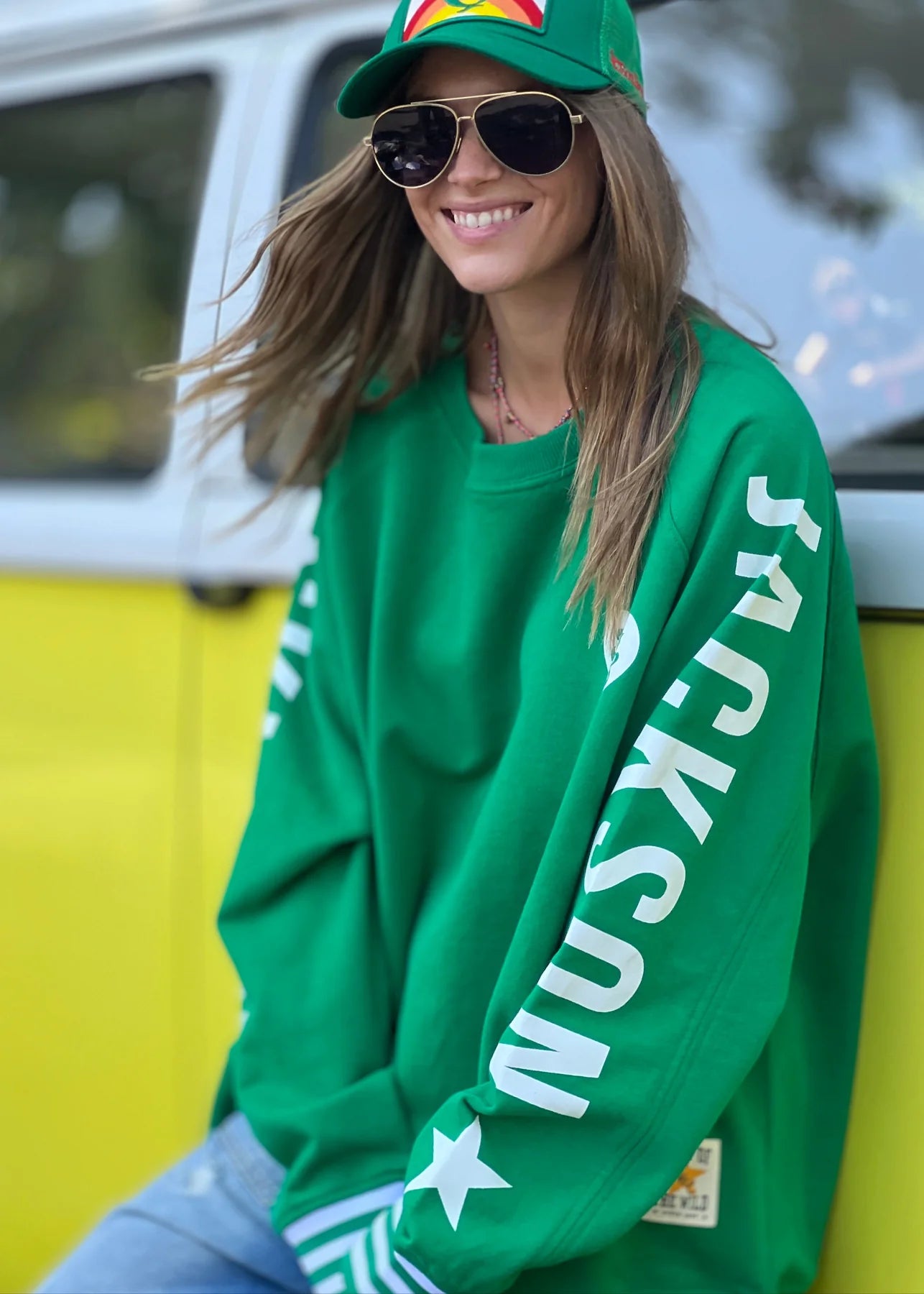 Model wearing Ski oversized stripe cuff jumper green by Hammill & Co