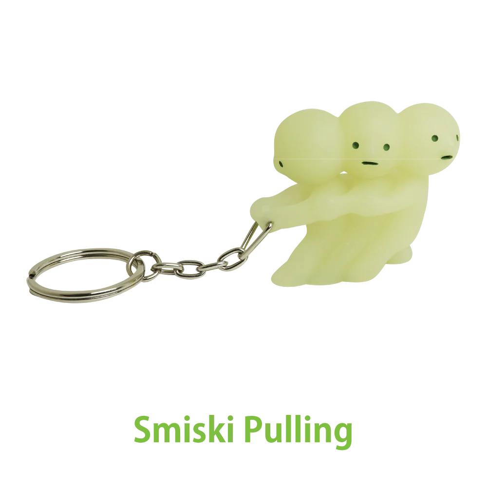 Smiski key chain with 3 smiski pulling the key