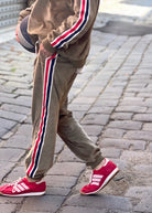 Sporty velour track pant khaki by Hammill & Co with red, blue and white stripe down sides