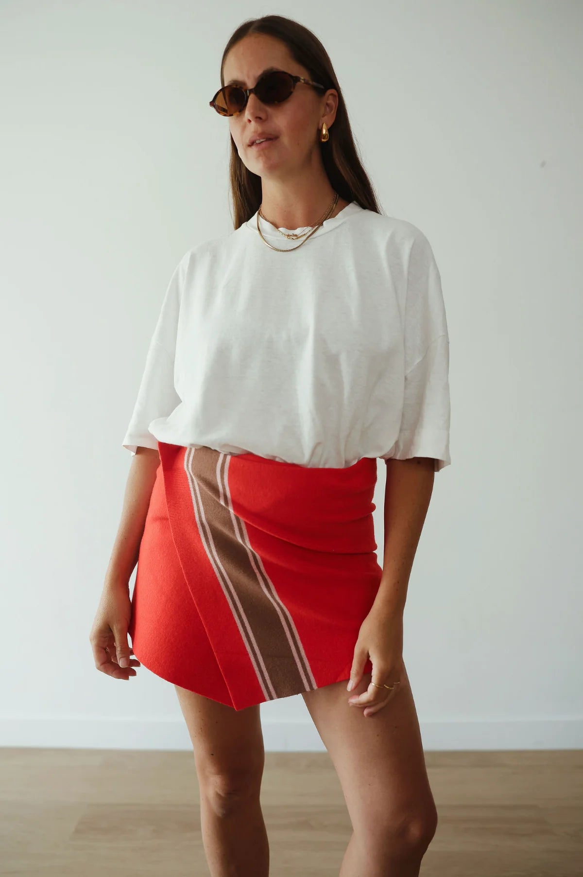model wearing Stripe Knit Skirt – Red by By Billie