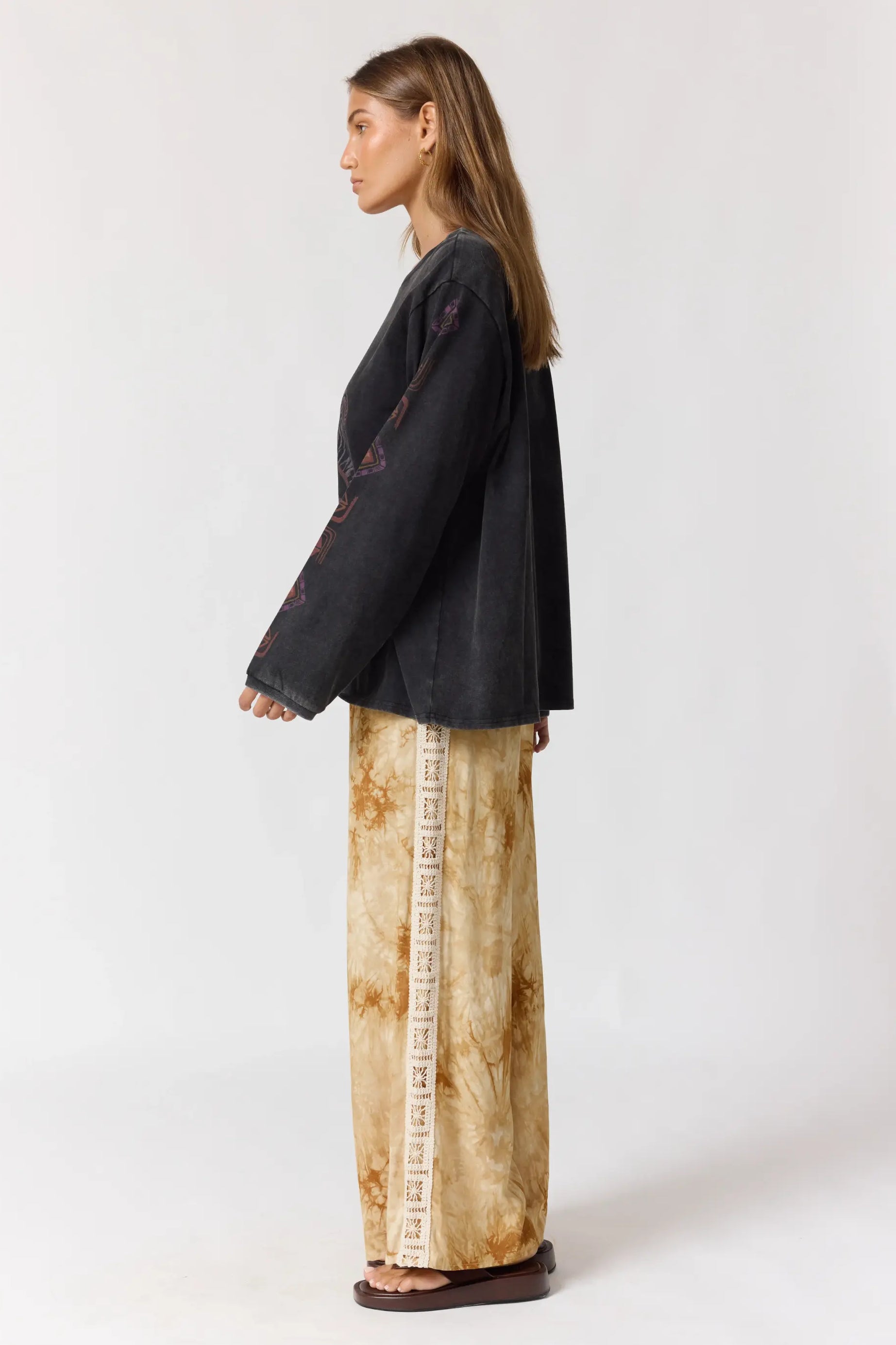 Back view of Sunday Pants showing wide leg silhouette and crochet lace side trim
