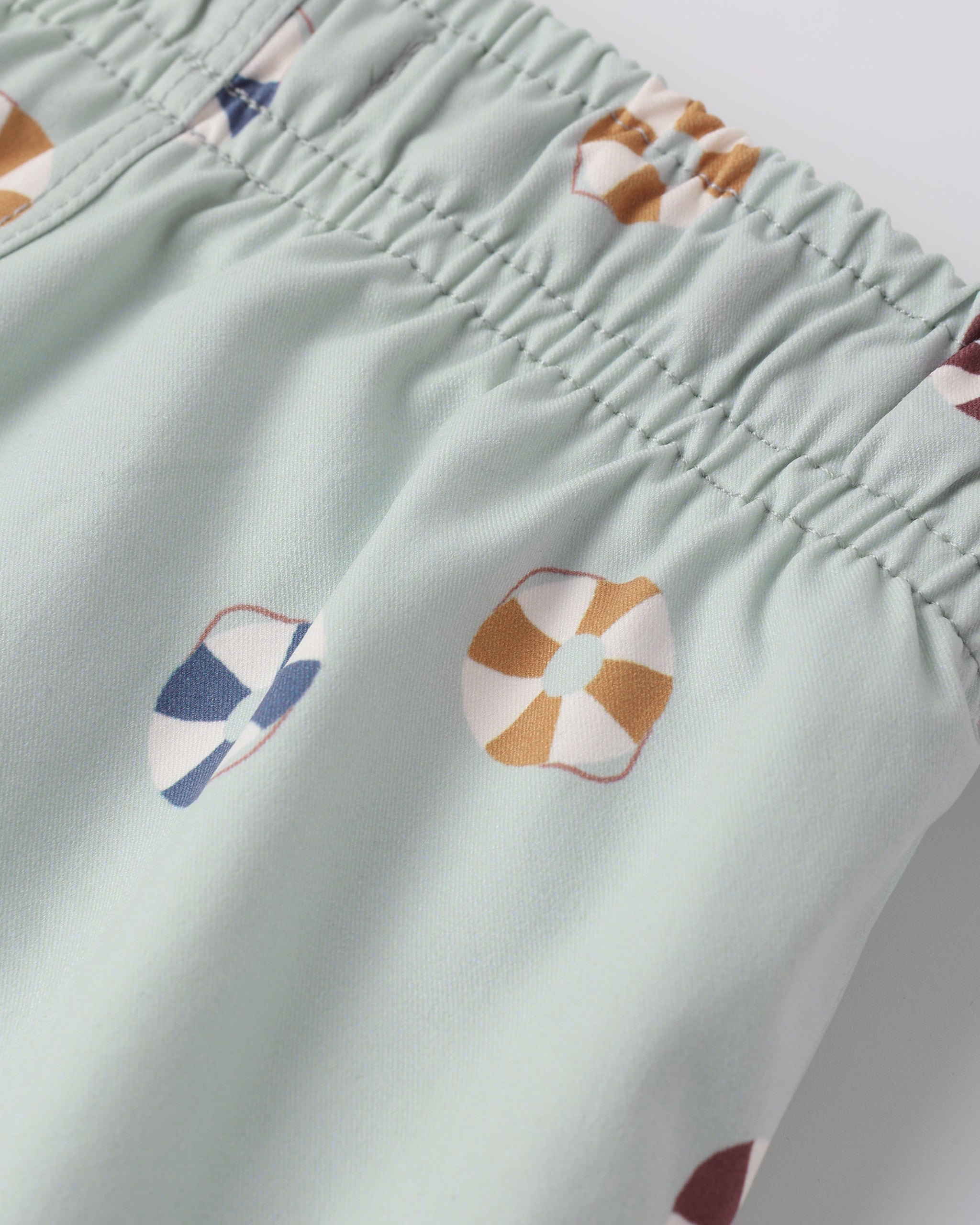 Close up of print and fabric on the Swim Trunk Floatie | Rylee + Cru