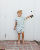 Front view of boy in Swim Trunk Floatie | Rylee + Cru