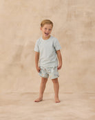 Boy wearing the Swim Trunk Floatie | Rylee + Cru